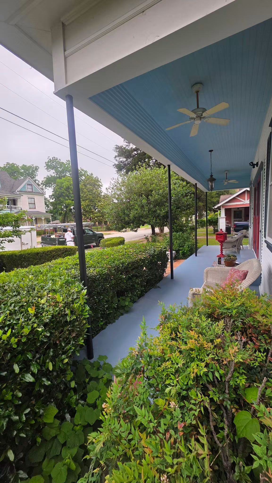 Historic historic porch with the original plain metal posts before custom column wraps were built
