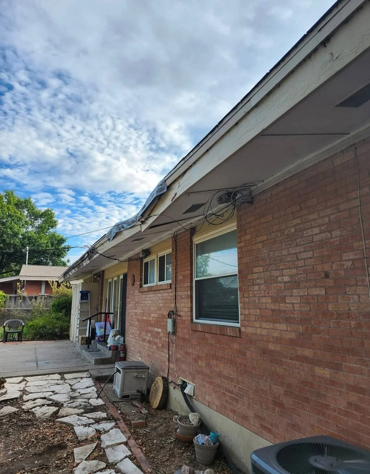 home before completion with the roofline, fascia, and soffit areas unfinished