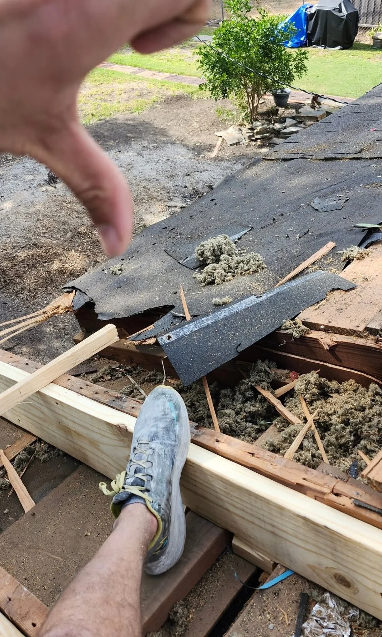 New rafter material installed beside the opened roof framing