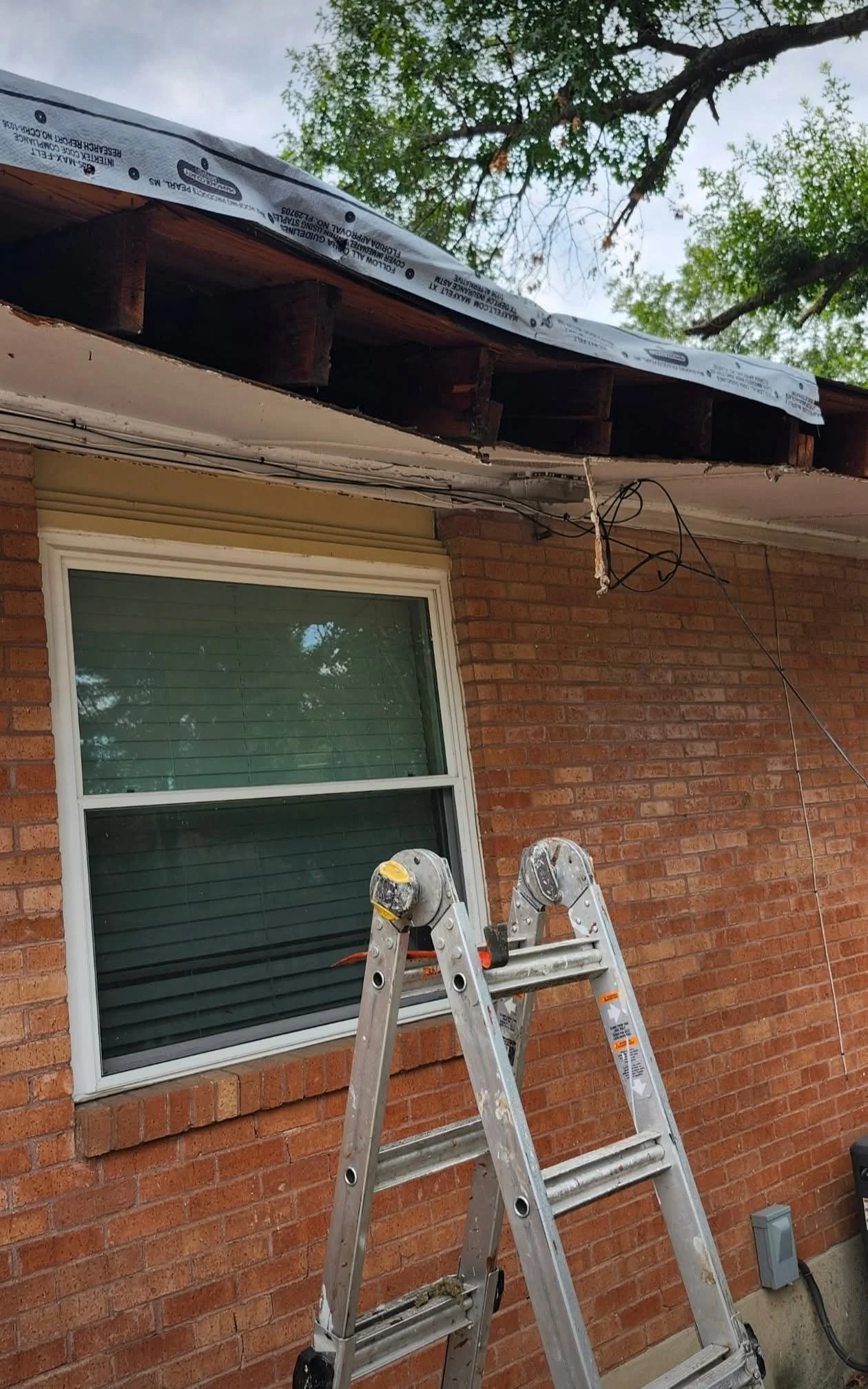 Rebuilt roofline with underlayment in place before the new roof was completed