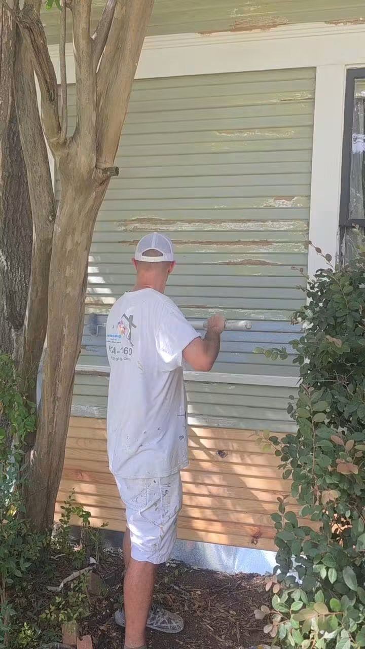 Exterior coating work on the home’s siding