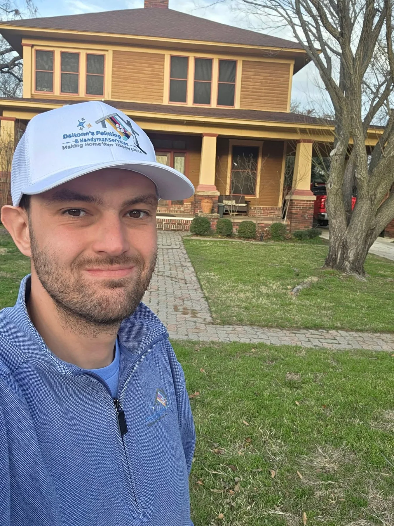 Daltonn in front of the 140-year-old Terrell home before the exterior restoration