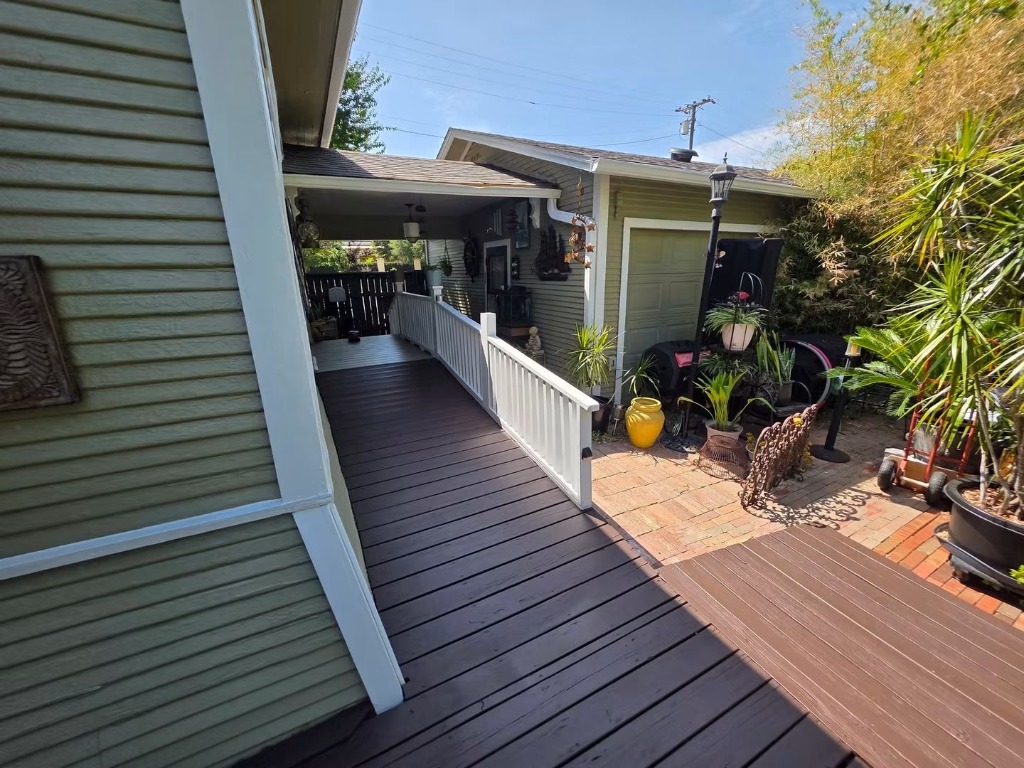 Finished deck railing, walkway, and solid-color stained boards
