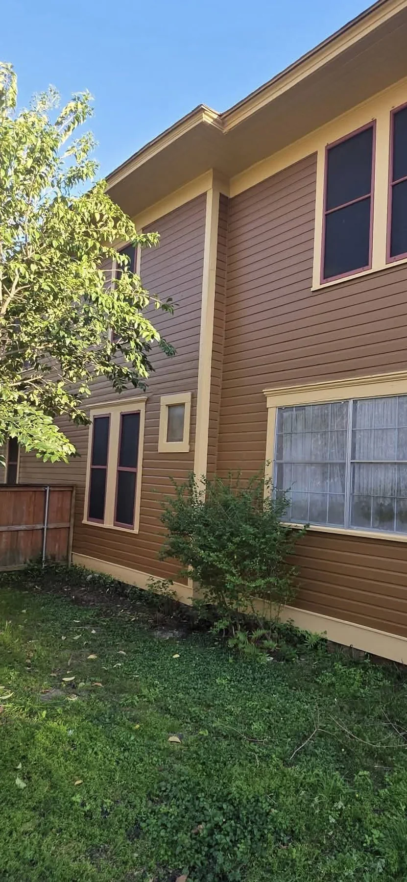 Finished window and siding details on the restored side elevation
