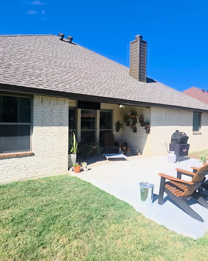 Back of the house and patio after the brick was limewashed