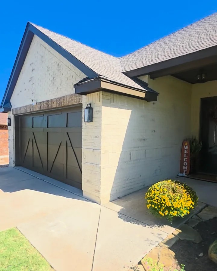 Front walk, garage, and porch entry after the brick was limewashed cream