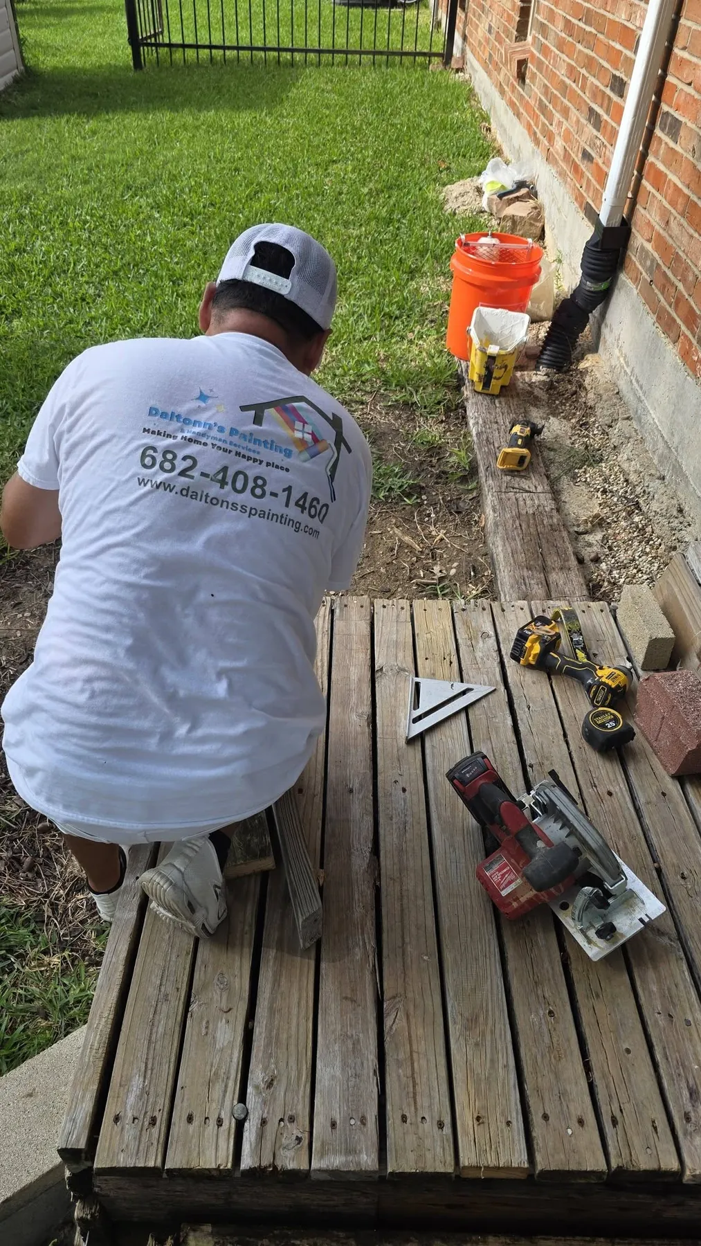 Crew member working on the covered deck railing