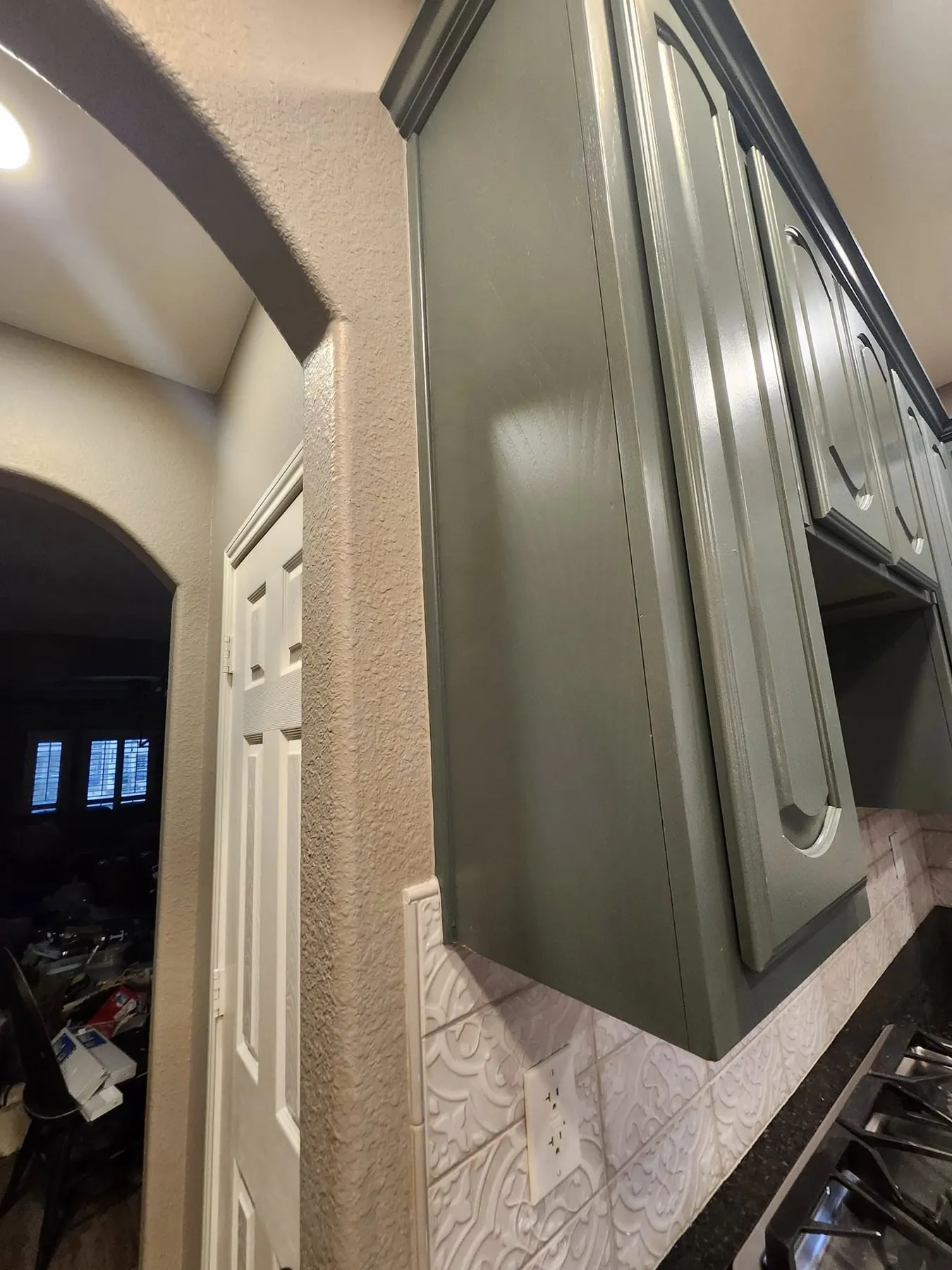 Close finished view of the green-gray cabinet coating