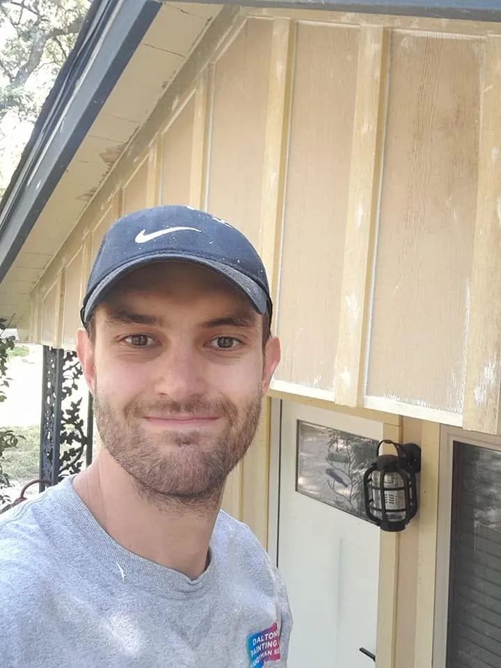 Daltonn at the tan cottage while exterior work is underway