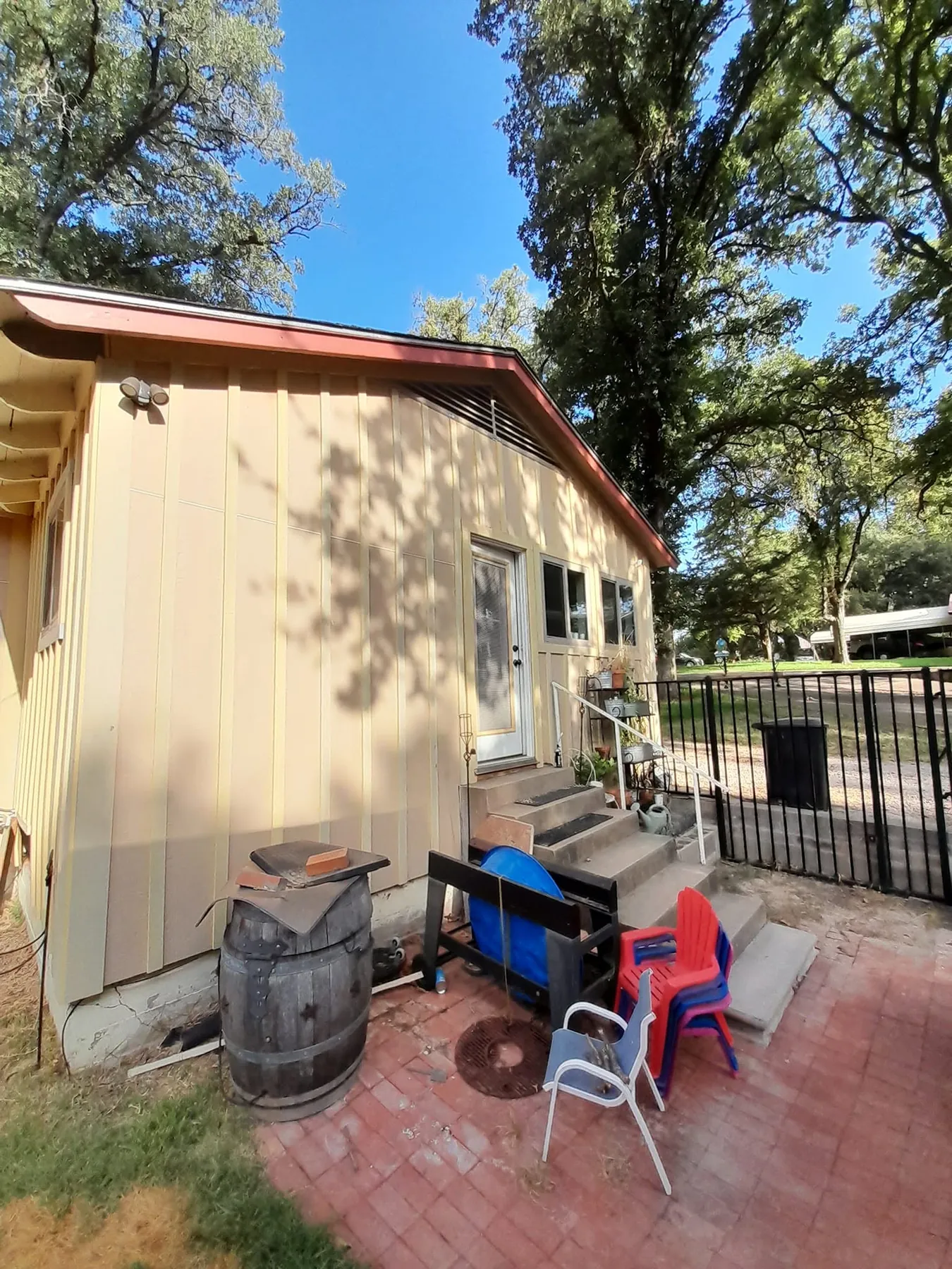 Tan side and rear elevations of the same cottage before repainting