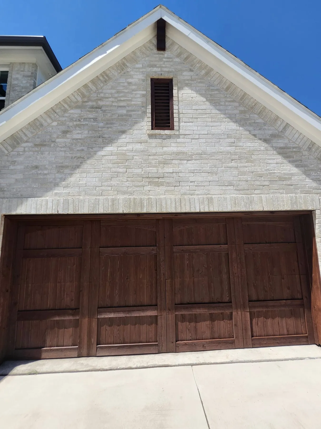 Close front view of the dark finished garage doors