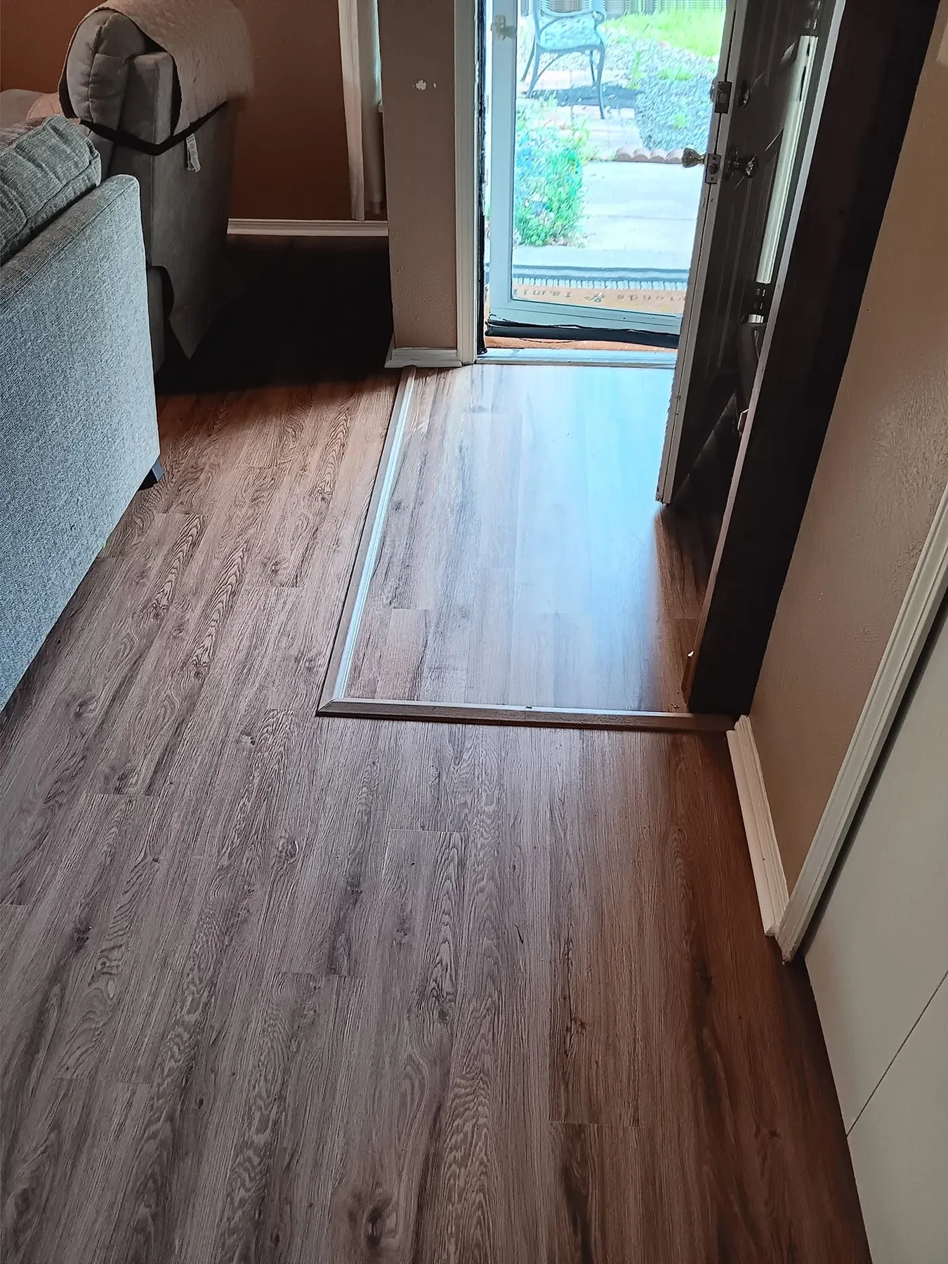 Finished wood-look flooring running through the hallway