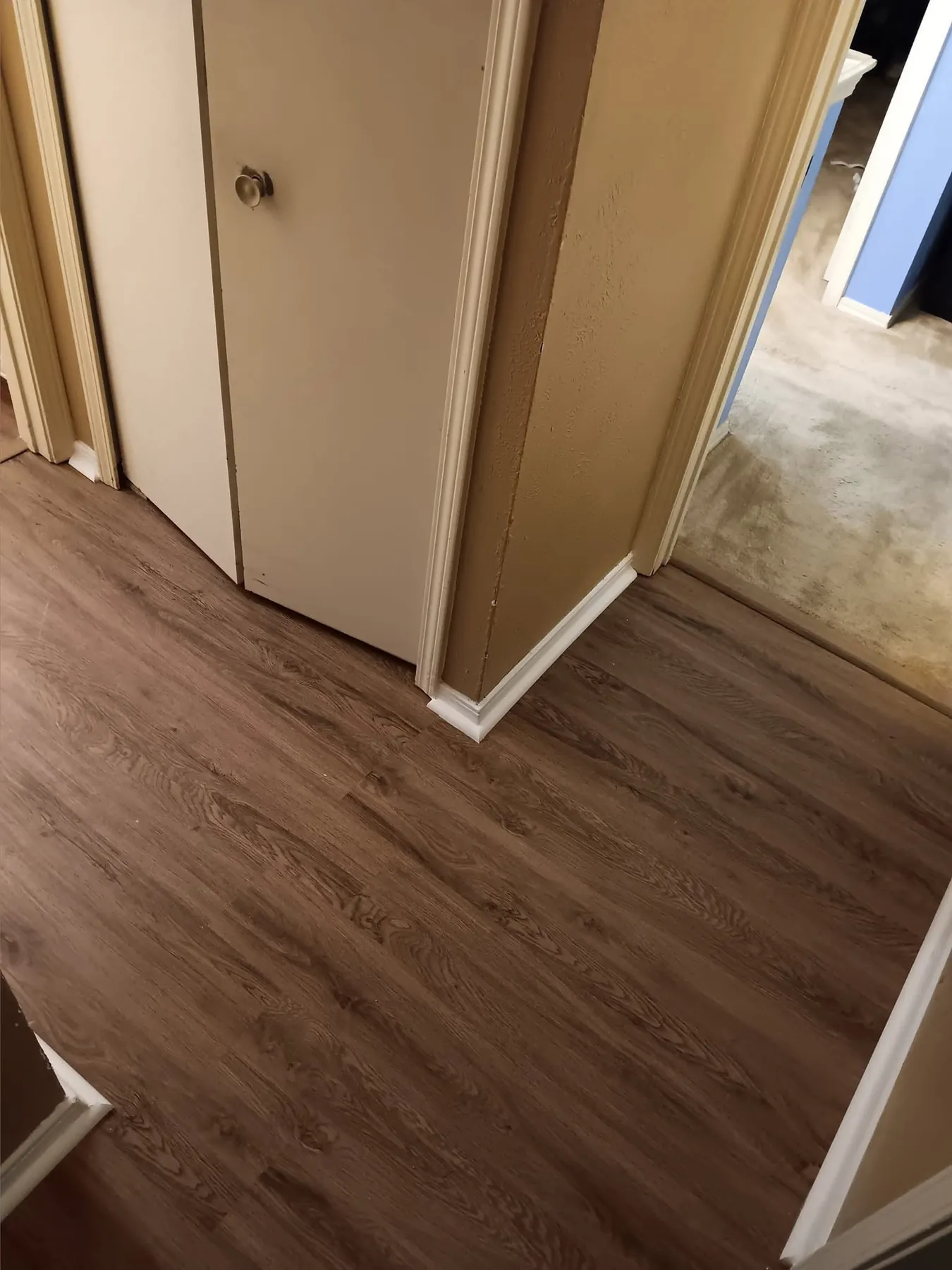 Finished flooring at a hallway and doorway transition