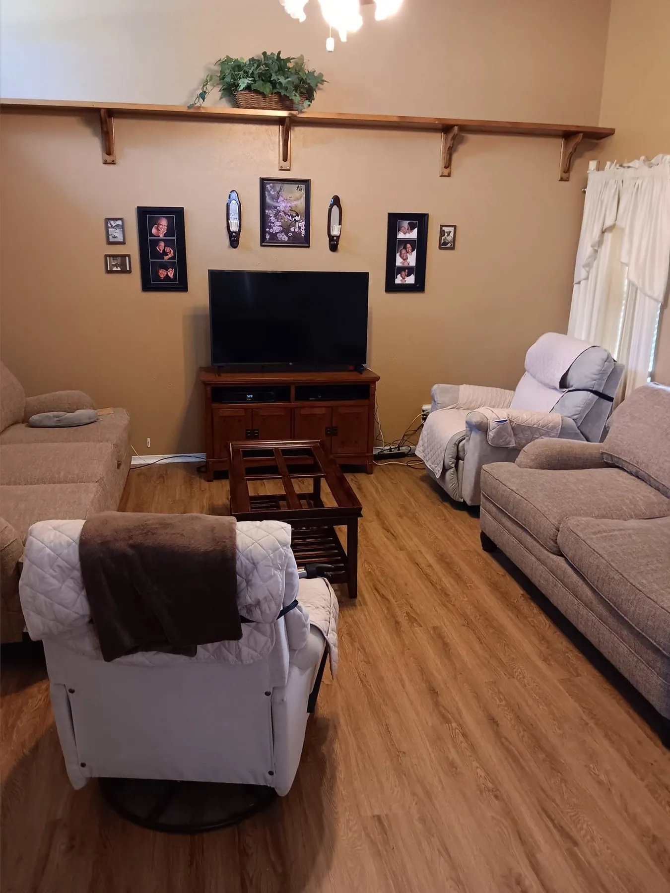 Completed living room with continuous wood-look flooring