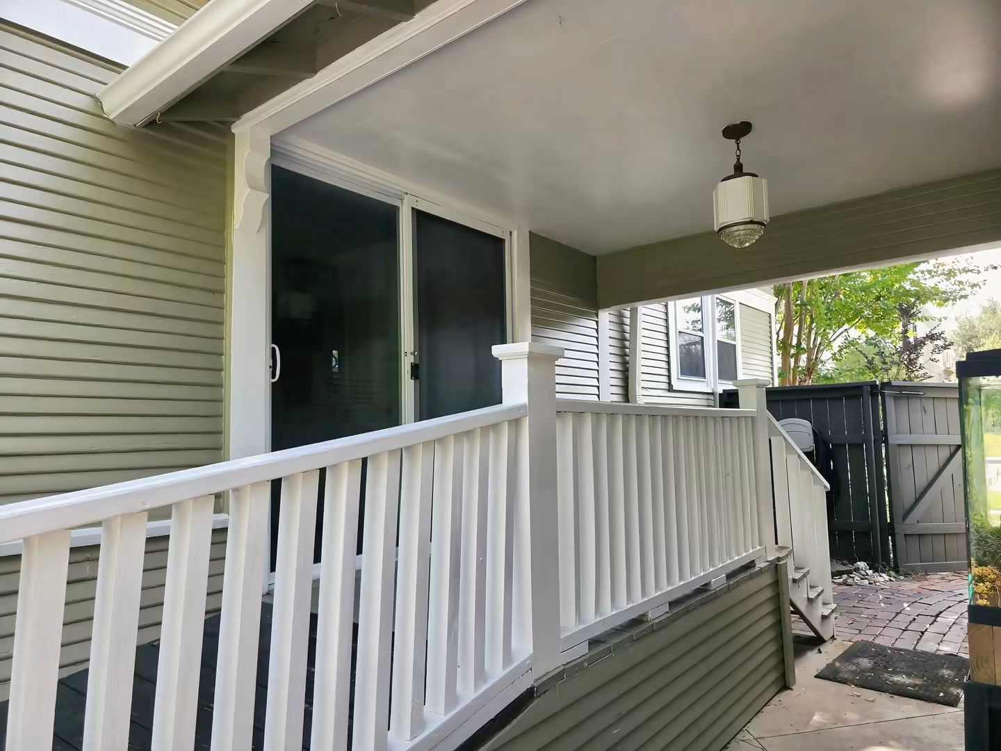 Finished covered porch railing, siding, ceiling, and trim