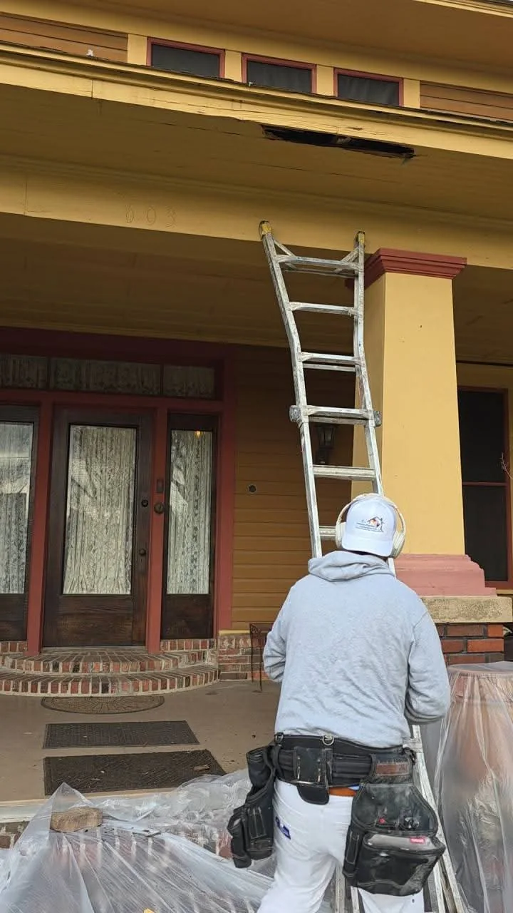 Porch and eave area opened for repair access during the restoration