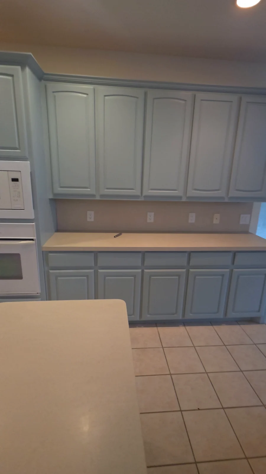 Painted upper and lower kitchen cabinets at the Terrell home