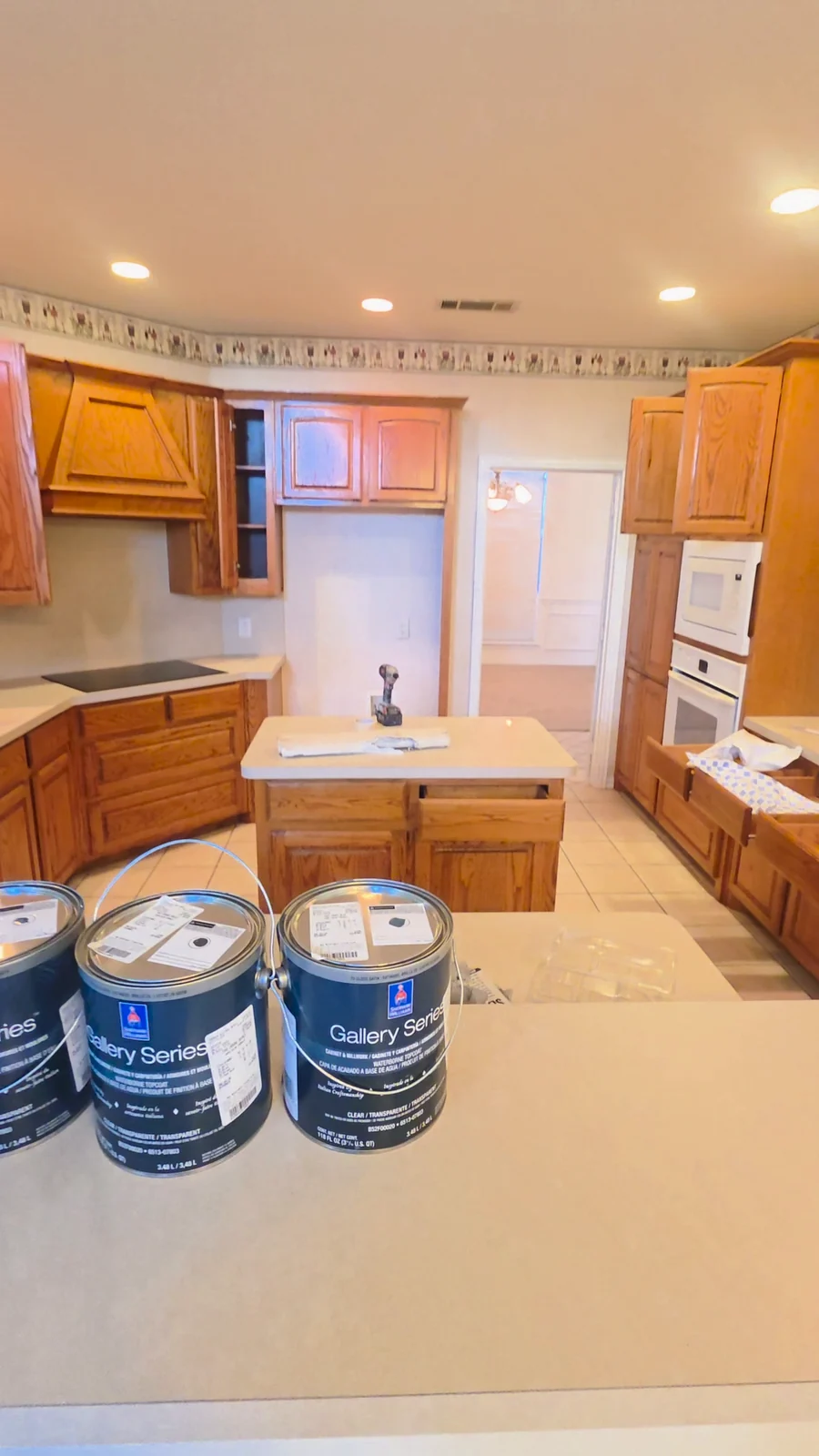 Wood kitchen cabinets before painting at the Terrell home